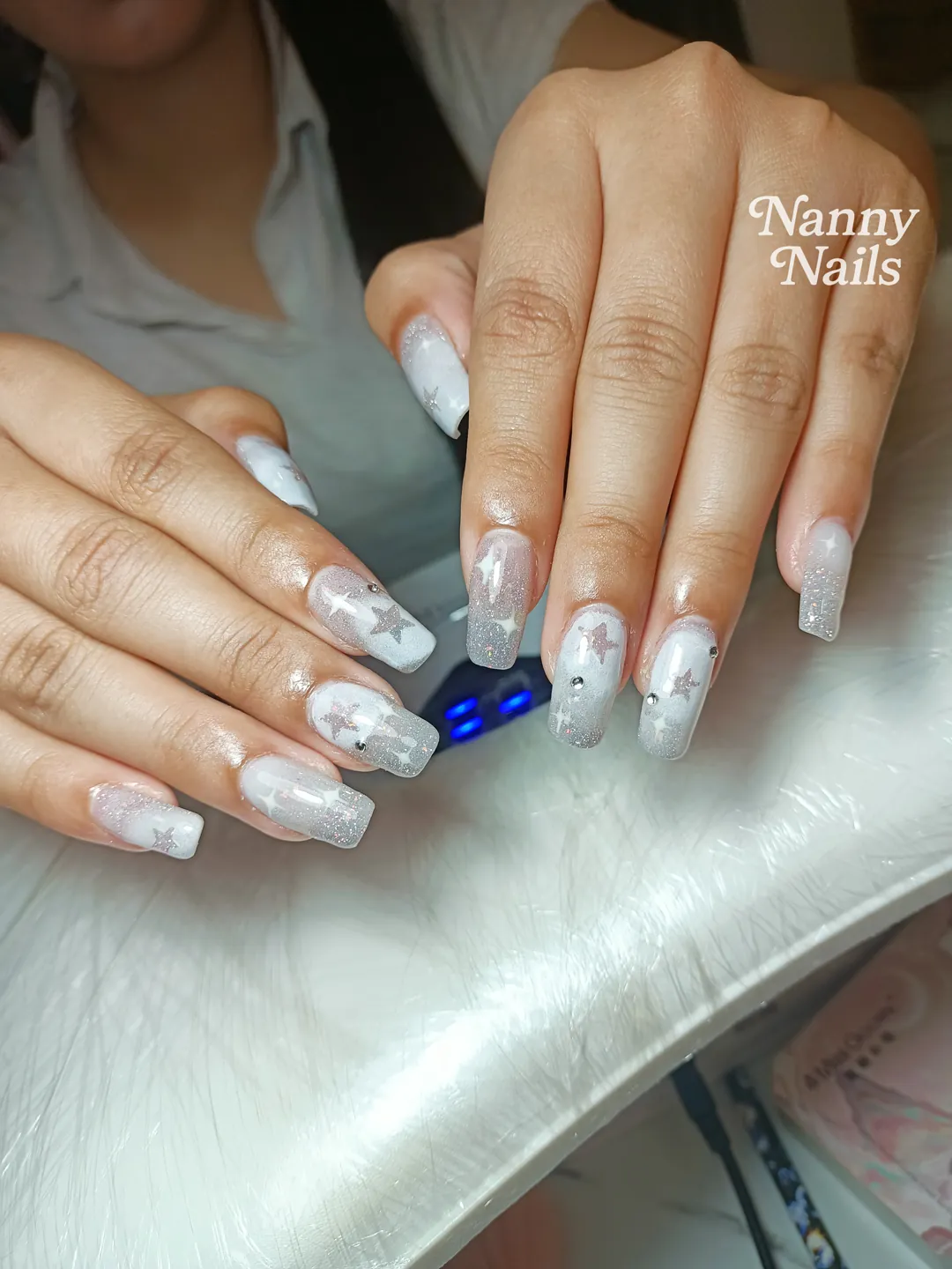White & Grey glitter, hand-painted, rhinestones nails — nail design A105 at Nanny Nails, nail salon in Nakhon Phanom Thailand