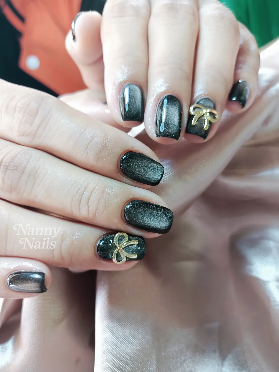 Black & Gold cat eye, rhinestones nails — nail design A16 at Nanny Nails, nail salon in Nakhon Phanom Thailand