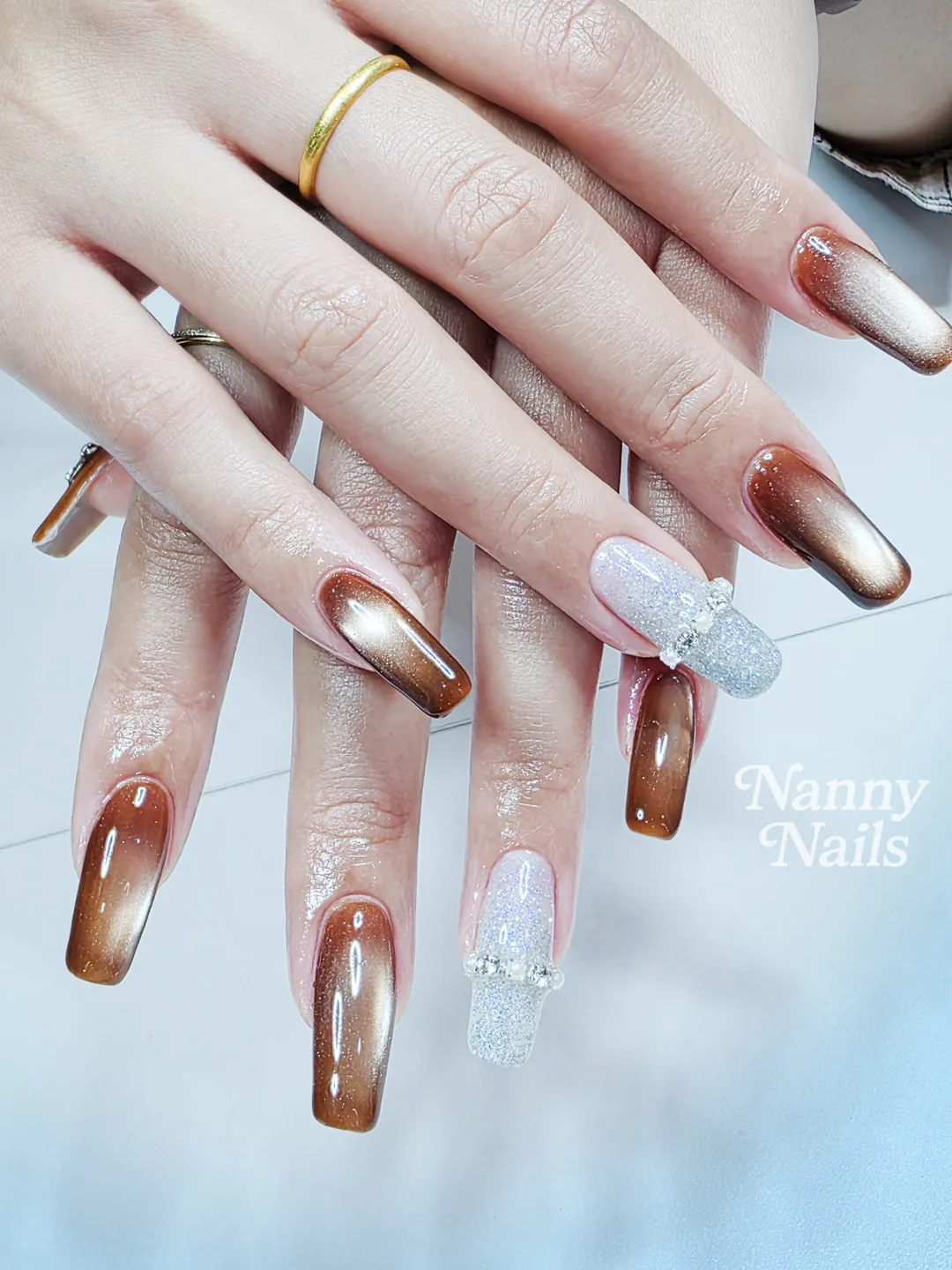 Brown & White ombré, cat eye, glitter, rhinestones nails — nail design A170 at Nanny Nails, nail salon in Nakhon Phanom Thailand