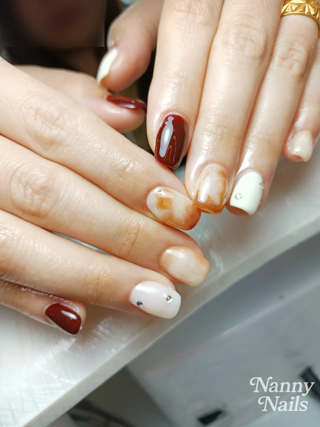 Brown, White & Nude hand-painted, rhinestones nails — nail design A191 at Nanny Nails, nail salon in Nakhon Phanom Thailand