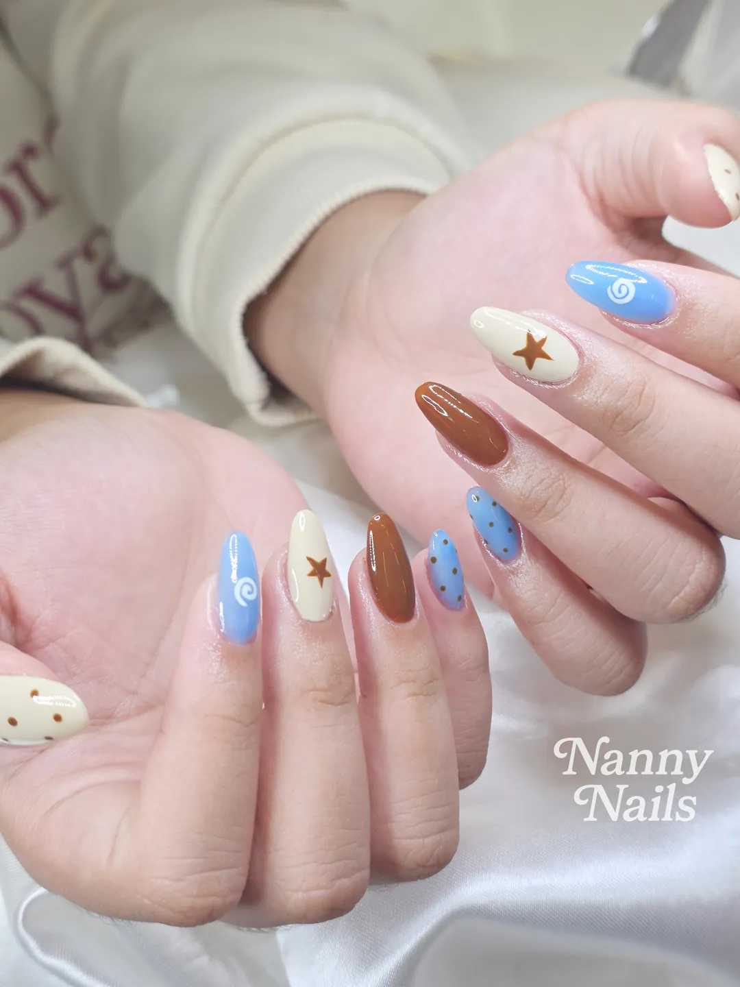 Light blue, Brown & Cream hand-painted nails — nail design A281 at Nanny Nails, nail salon in Nakhon Phanom Thailand