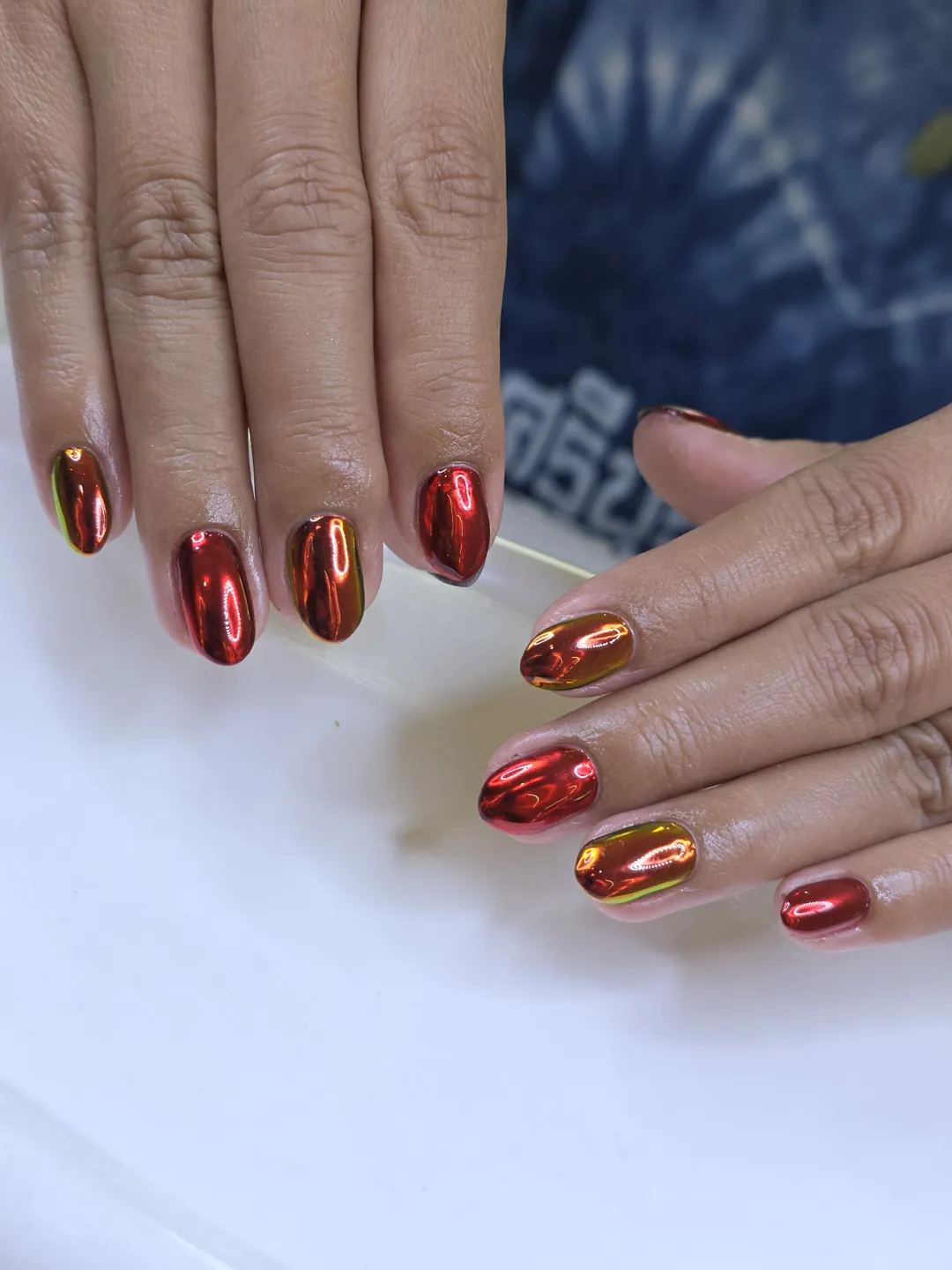 Red & Gold chrome nails — nail design A495 at Nanny Nails, nail salon in Nakhon Phanom Thailand