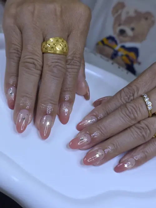 Nude glitter, reflective flash nails — nail design A486 at Nanny Nails, nail salon in Nakhon Phanom Thailand