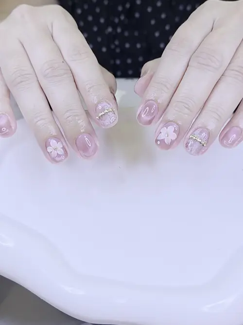 Pink, White & Gold hand-painted, cat eye, rhinestones nails — nail design A552 at Nanny Nails, nail salon in Nakhon Phanom Thailand
